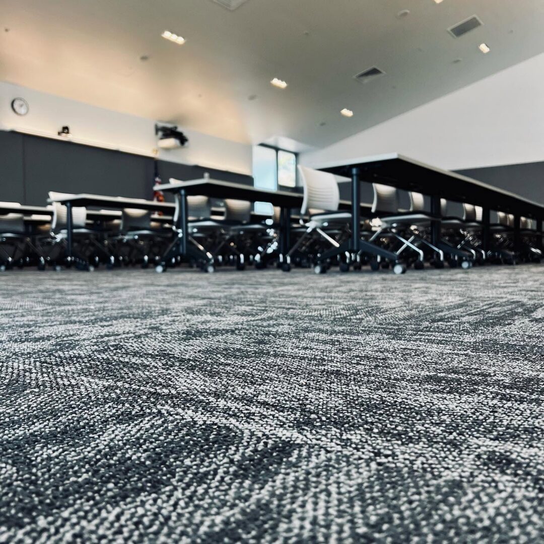 Modern classroom with grey patterned carpet